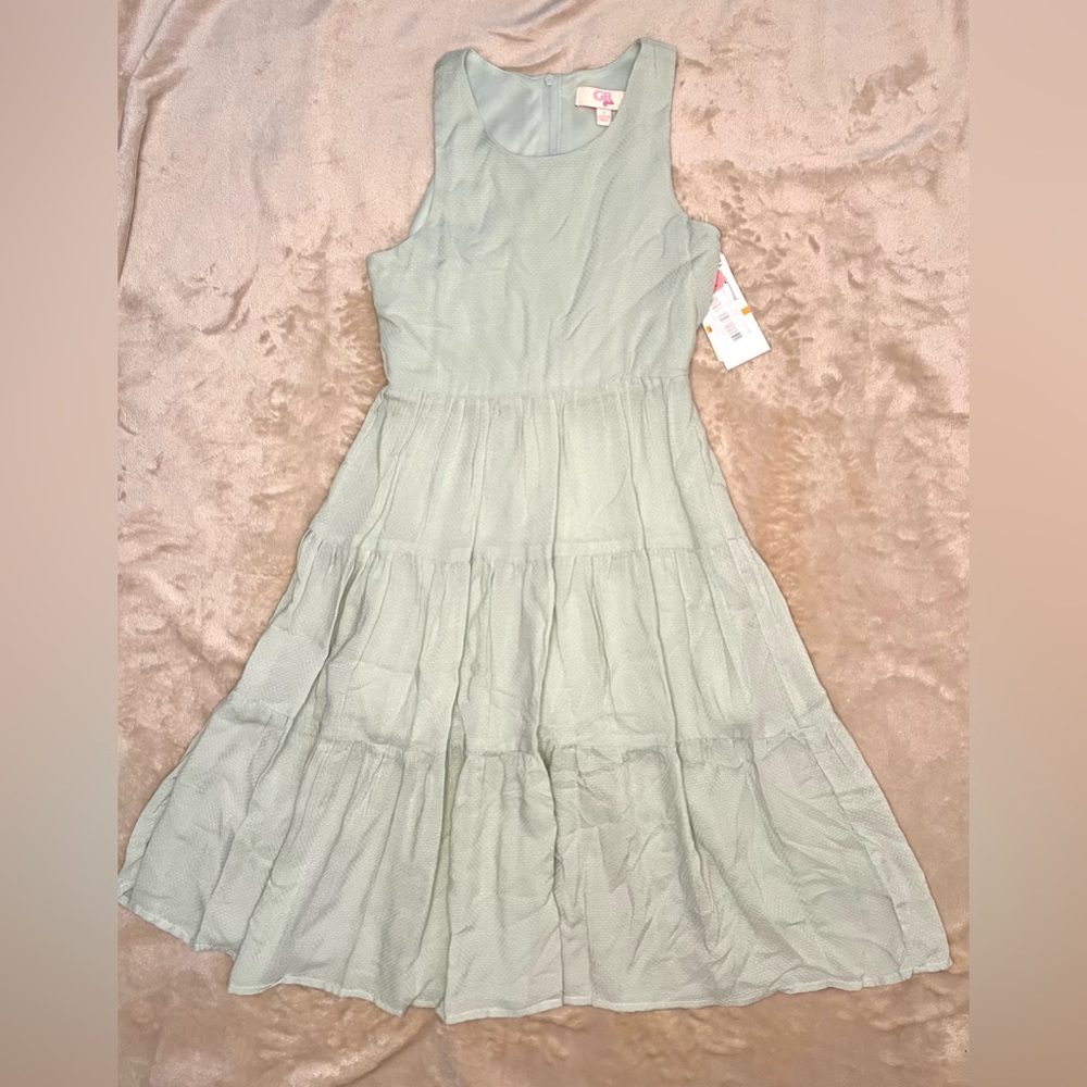 New with tags.  Girls size 7 sage green long dress by GB Girls.